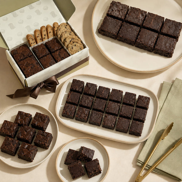 Ruth’s extra-fudgy brownies and brownie bites arranged on party platters with branded packaging
