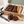 Chocolate chunk brownies, chocolate cookie and almond biscotti beside Ruth’s open kraft gift box