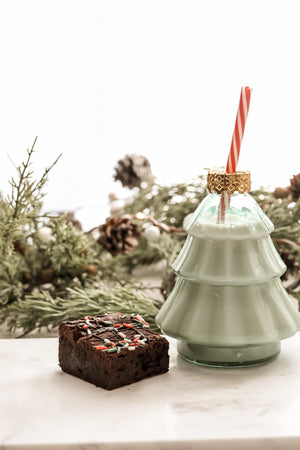 One of Ruth’s Christmas-decorated fudgy brownies styled with holiday greenery