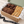 Angled view of Ruth’s large dessert gift box with brownies, cookies, biscotti and branded tissue paper