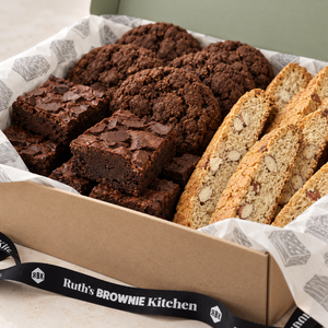 Close-up of chocolate chunk brownies, chocolate cookies and almond biscotti in Ruth’s large gift box