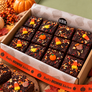 Close-up of Thanksgiving decorated fudgy brownies with fall sprinkles and candy corn